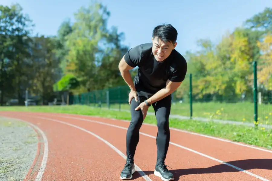 runner with muscle pain